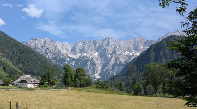 Lake Bled in Slovenia, with mountains, trees, and an island with a church (tourist holiday image)