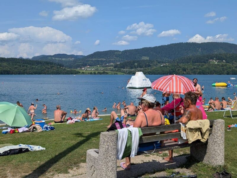 View of Lake Velenje with beach and mountains in Slovenia
